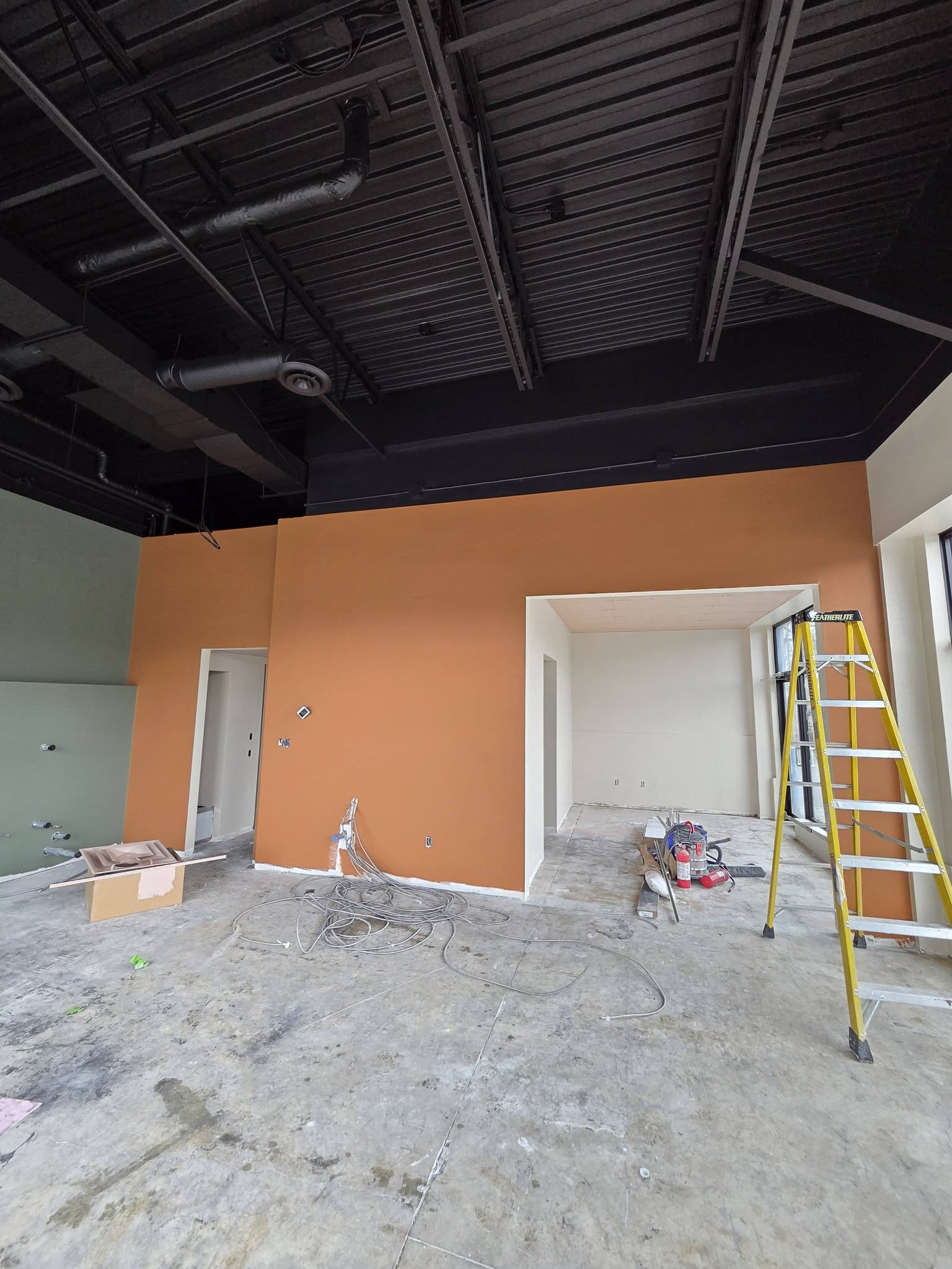 Commercial interior with orange feature wall